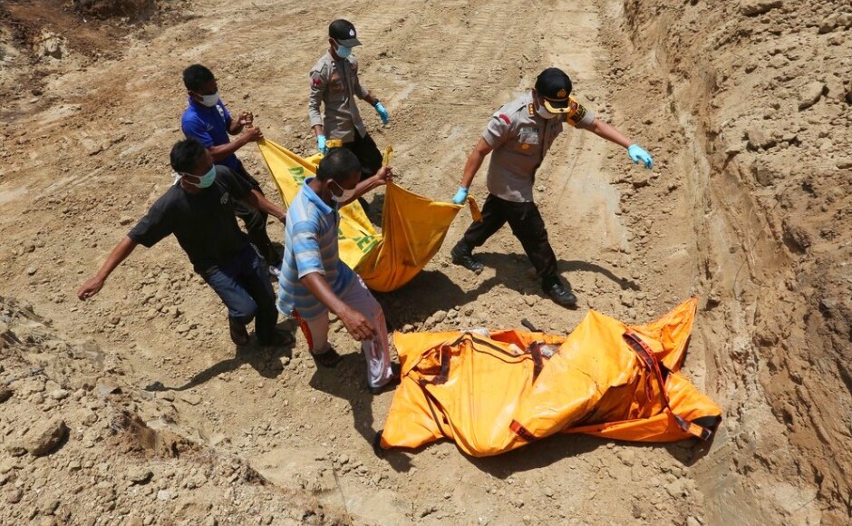 Mass graves were being readied for victims of the disaster in a desperate attempt to stave off disease. The authorities said that the death toll is expected to rise further. AP Mass graves were being readied for victims of the disaster in a desperate attempt to stave off disease. The authorities said that the death toll is expected to rise further. AP